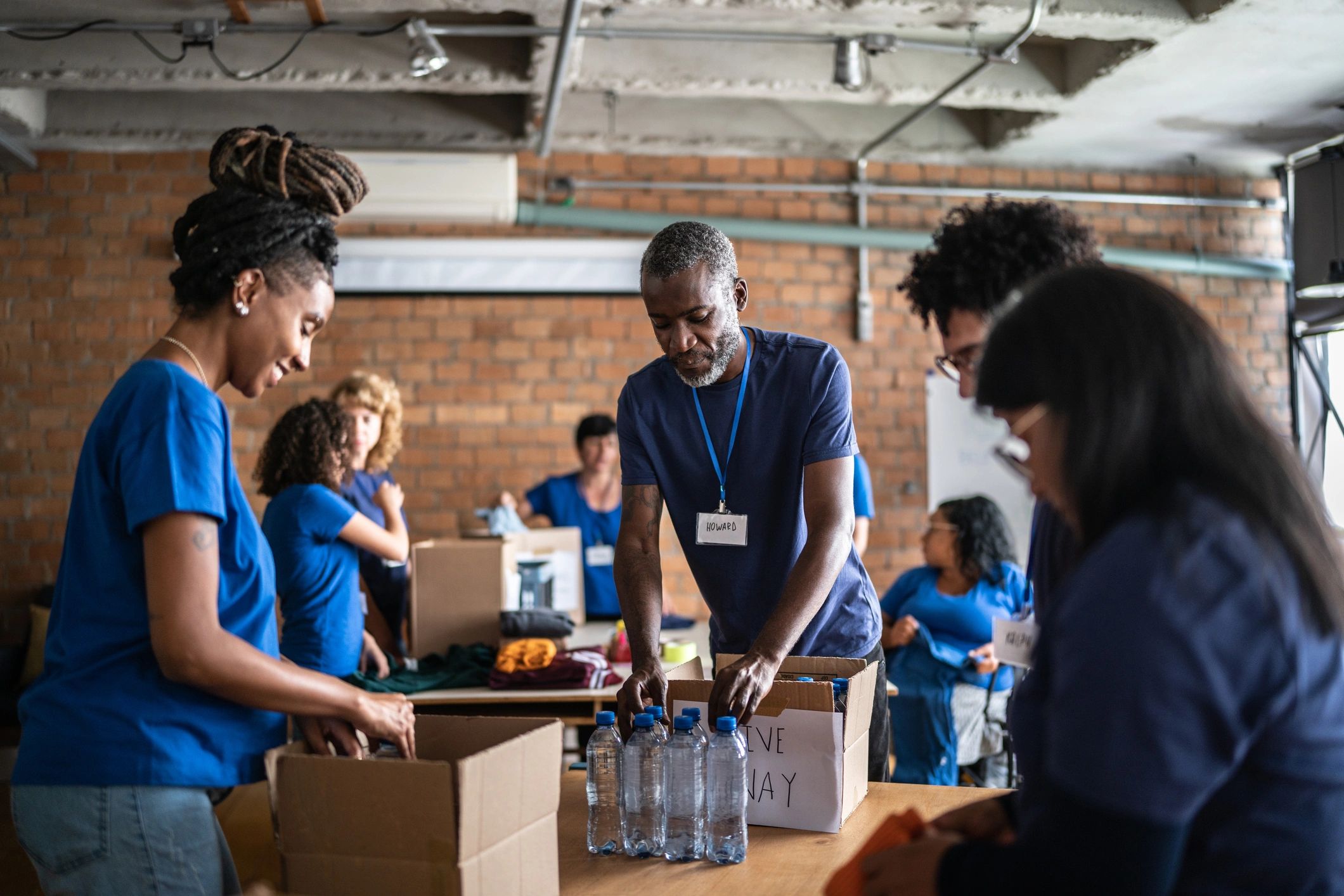 Volunteers working together at a community donation center